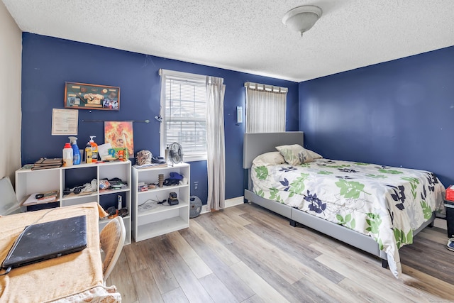 16 Hodge Ave, Ansonia, CT 06401 - bedroom featuring a textured ceiling, wood finished floors, and baseboards