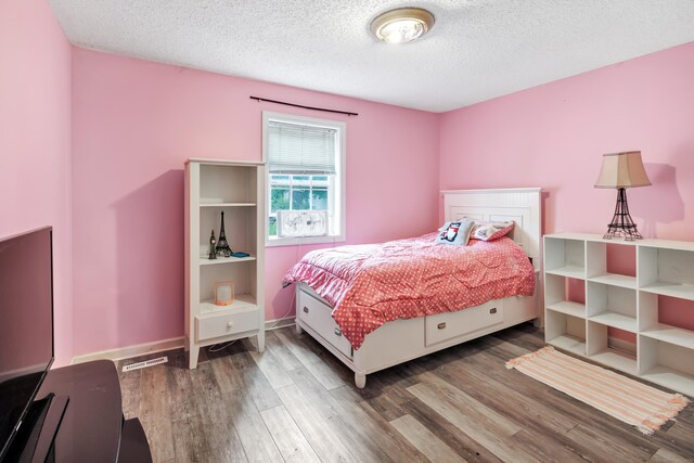 16 Hodge Ave, Ansonia, CT 06401 - bedroom with a textured ceiling, wood finished floors, and baseboards