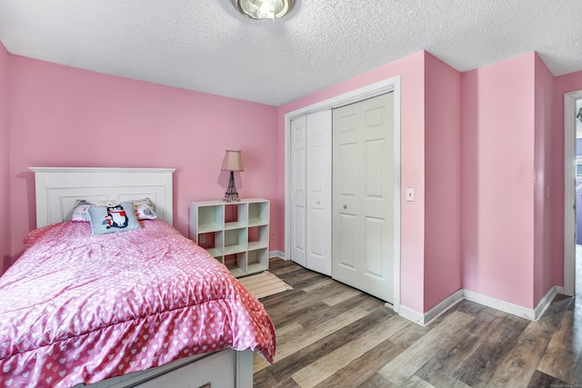 16 Hodge Ave, Ansonia, CT 06401 - bedroom featuring wood finished floors, a closet, a textured ceiling, and baseboards