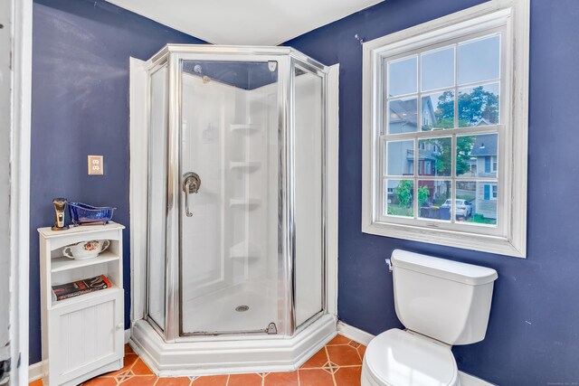16 Hodge Ave, Ansonia, CT 06401 - full bath with baseboards, a stall shower, toilet, and tile patterned flooring