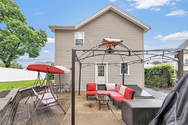 16 Hodge Ave, Ansonia, CT 06401 - fenced backyard featuring outdoor lounge area, a patio, and outdoor dining area