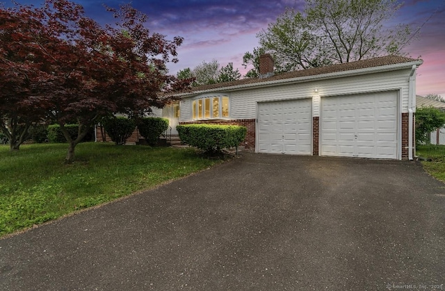 24 Linde St, West Haven, CT 06516 - single story home with a chimney, driveway, a garage, brick siding, and a front lawn
