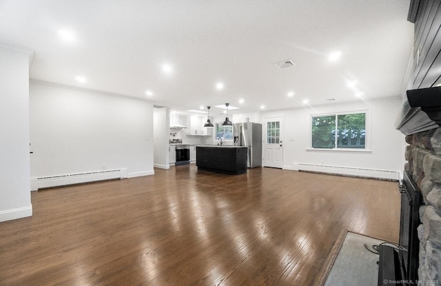 24 Linde St, West Haven, CT 06516 - unfurnished living room with a baseboard radiator, a fireplace, dark wood-type flooring, baseboards, and recessed lighting