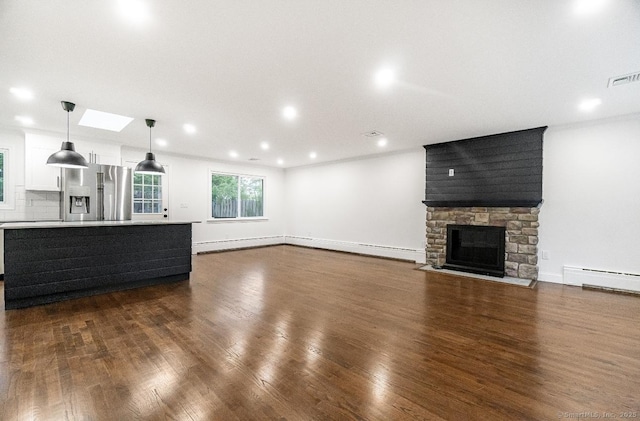 24 Linde St, West Haven, CT 06516 - unfurnished living room with baseboard heating, dark wood-type flooring, a fireplace, baseboards, and ornamental molding