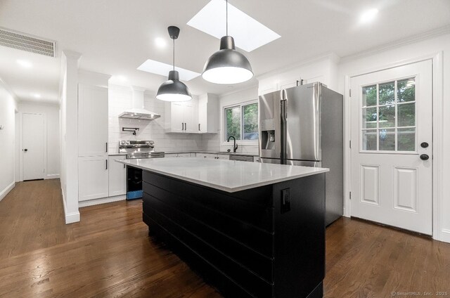 24 Linde St, West Haven, CT 06516 - kitchen with wall chimney range hood, stainless steel appliances, a sink, dark wood-style flooring, and ornamental molding