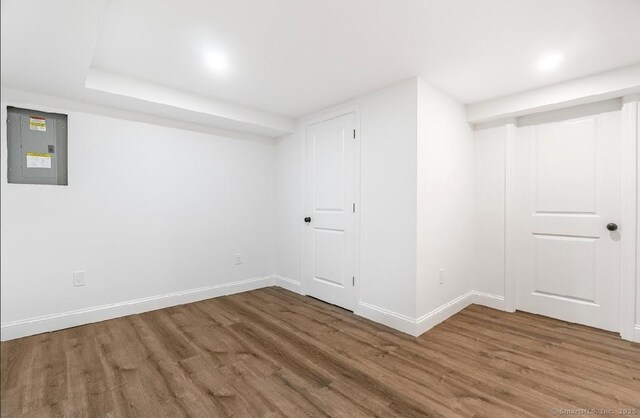 24 Linde St, West Haven, CT 06516 - finished basement with electric panel, wood finished floors, and baseboards