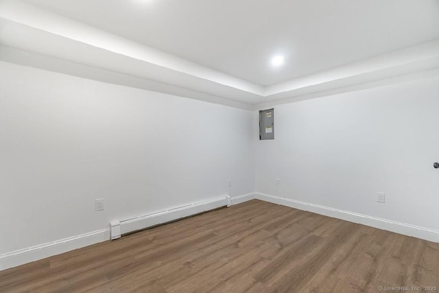 24 Linde St, West Haven, CT 06516 - unfurnished room with a baseboard heating unit, wood finished floors, baseboards, and a tray ceiling