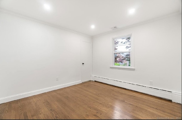 24 Linde St, West Haven, CT 06516 - empty room featuring crown molding, a baseboard heating unit, wood finished floors, and baseboards