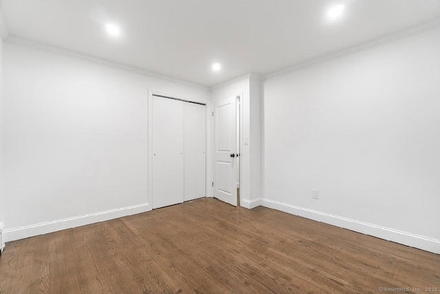 24 Linde St, West Haven, CT 06516 - unfurnished bedroom with ornamental molding, wood finished floors, baseboards, a closet, and recessed lighting