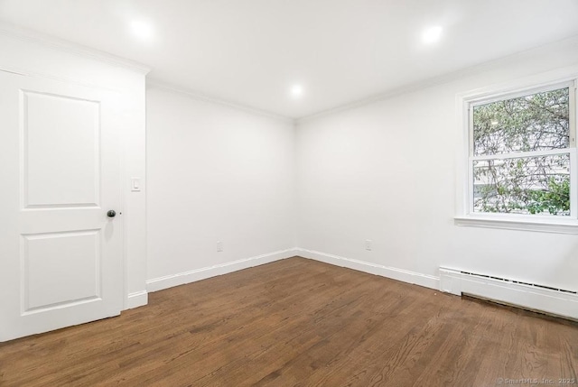 24 Linde St, West Haven, CT 06516 - empty room with wood finished floors, ornamental molding, baseboards, and a baseboard radiator