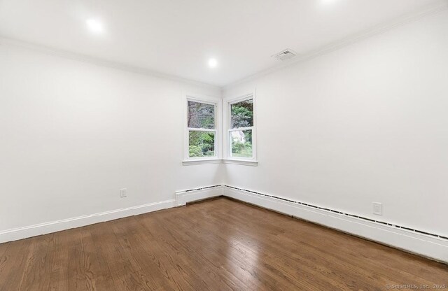 24 Linde St, West Haven, CT 06516 - unfurnished room with ornamental molding, wood finished floors, a baseboard radiator, and baseboards