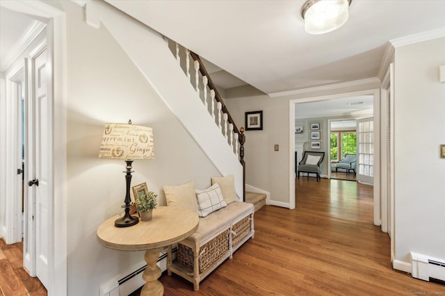 8 Buttonwood Dr, Simsbury, CT 06070 - hall featuring baseboard heating, stairs, wood finished floors, and crown molding