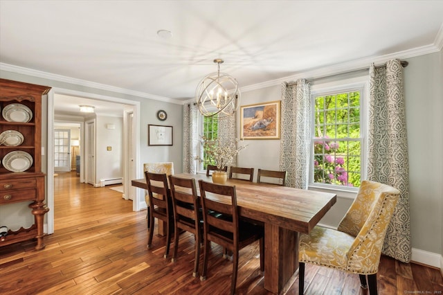 8 Buttonwood Dr, Simsbury, CT 06070 - dining room with baseboard heating, a chandelier, healthy amount of natural light, crown molding, and wood finished floors