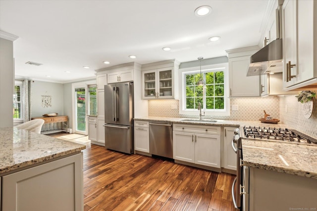 8 Buttonwood Dr, Simsbury, CT 06070 - kitchen with stainless steel appliances, extractor fan, dark wood-style floors, light stone counters, and recessed lighting