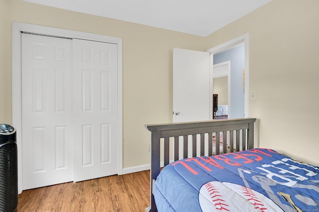 8 High Meadow Ln, Enfield, CT 06082 - bedroom featuring wood finished floors, a closet, and baseboards