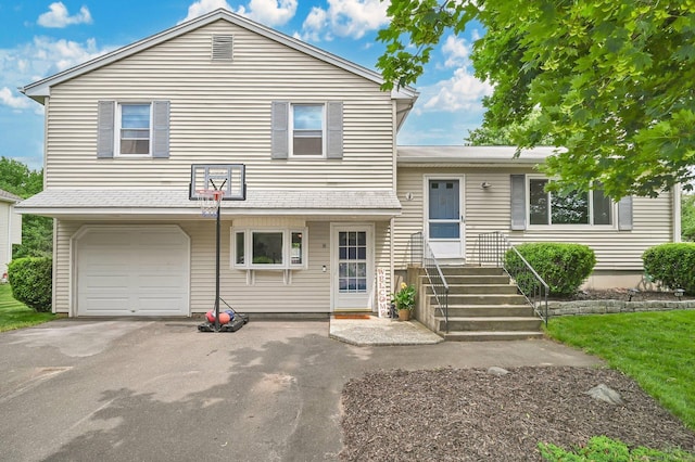 8 High Meadow Ln, Enfield, CT 06082 - split level home with a garage and asphalt driveway