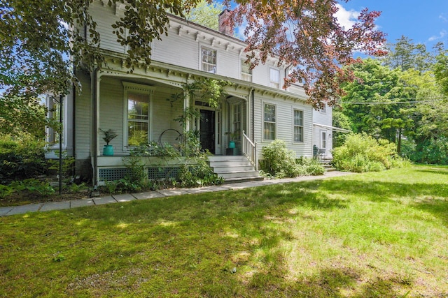 2 Summit St, Stonington, CT 06378 - italianate house with covered porch, a front yard, and a chimney