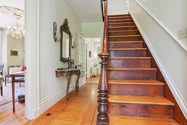2 Summit St, Stonington, CT 06378 - stairs with wood-type flooring and a chandelier