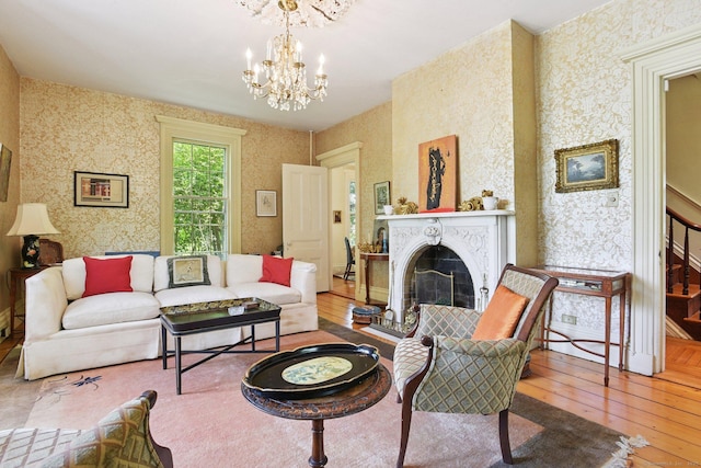 2 Summit St, Stonington, CT 06378 - living area featuring wallpapered walls, hardwood / wood-style flooring, a chandelier, and a fireplace