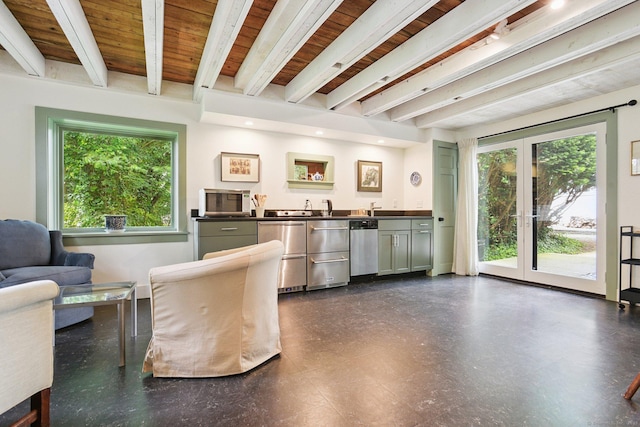2 Summit St, Stonington, CT 06378 - living room with plenty of natural light, bar with sink, dark floors, a wood ceiling with exposed beams, and french doors