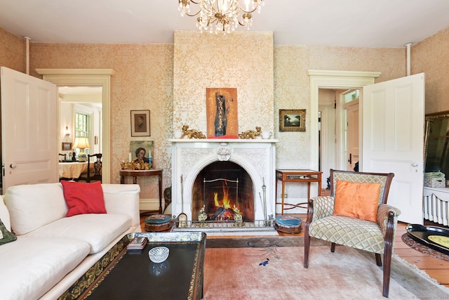 2 Summit St, Stonington, CT 06378 - living area with a chandelier, wood finished floors, and a high end fireplace