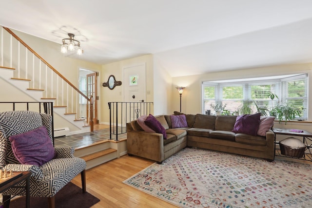 81 Park Rd, Woodbury, CT 06798 - living area with a baseboard radiator, wood finished floors, a chandelier, and stairs