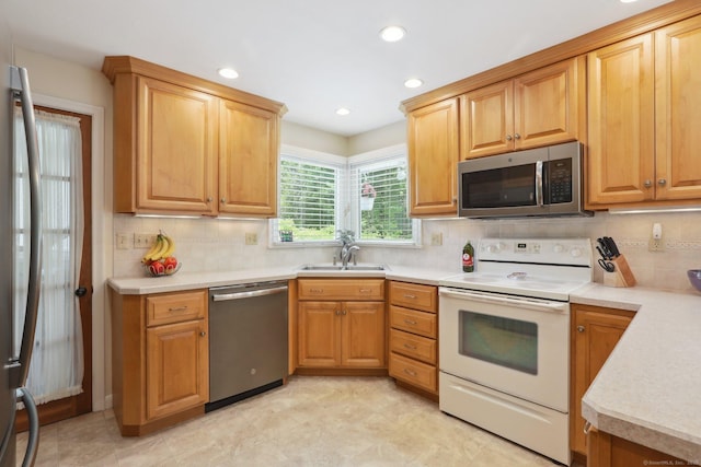 81 Park Rd, Woodbury, CT 06798 - kitchen with appliances with stainless steel finishes, a sink, decorative backsplash, light countertops, and recessed lighting