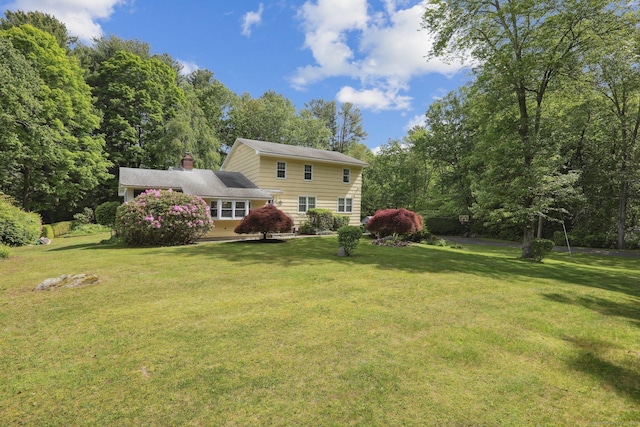 81 Park Rd, Woodbury, CT 06798 - back of house with a yard and a chimney