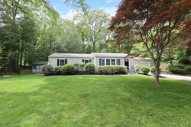 28 Shields Ln, Ridgefield, CT 06877 - view of front of home featuring a garage, a chimney, driveway, and a front yard