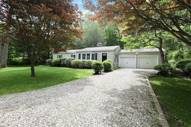 28 Shields Ln, Ridgefield, CT 06877 - single story home with driveway, a garage, a front lawn, and a chimney