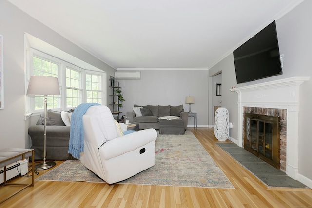 28 Shields Ln, Ridgefield, CT 06877 - living room featuring an AC wall unit, a brick fireplace, a baseboard heating unit, wood finished floors, and ornamental molding