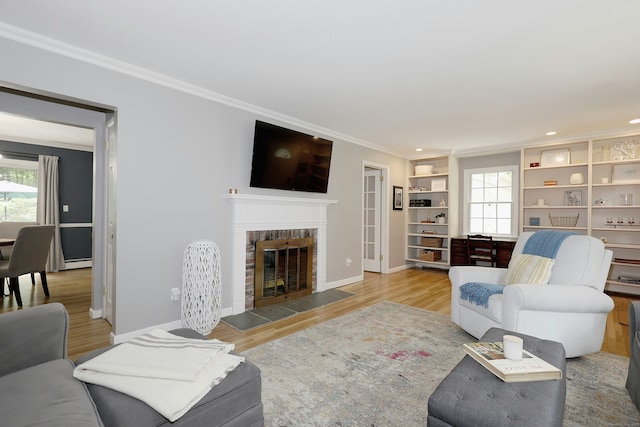28 Shields Ln, Ridgefield, CT 06877 - living room with a fireplace, healthy amount of natural light, crown molding, baseboards, and recessed lighting