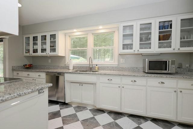 28 Shields Ln, Ridgefield, CT 06877 - kitchen featuring stainless steel appliances, a sink, white cabinets, and healthy amount of natural light
