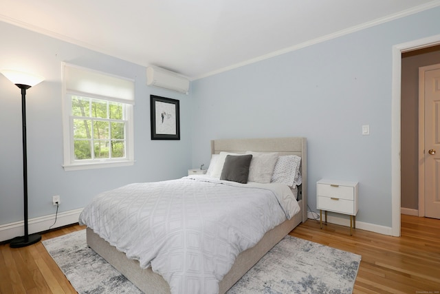 28 Shields Ln, Ridgefield, CT 06877 - bedroom featuring a wall unit AC, ornamental molding, wood finished floors, and baseboards
