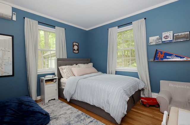 28 Shields Ln, Ridgefield, CT 06877 - bedroom featuring wood finished floors, ornamental molding, baseboards, and a wall mounted air conditioner