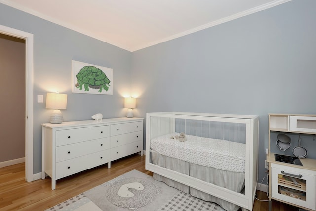 28 Shields Ln, Ridgefield, CT 06877 - bedroom with wood finished floors, baseboards, and ornamental molding