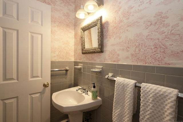 28 Shields Ln, Ridgefield, CT 06877 - bathroom featuring wallpapered walls, wainscoting, and a sink