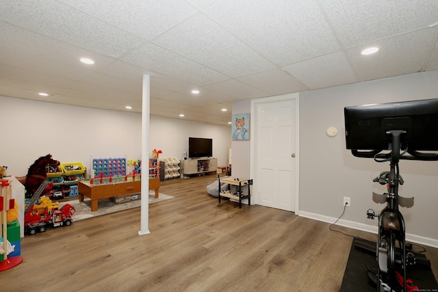 28 Shields Ln, Ridgefield, CT 06877 - workout area with wood finished floors, a paneled ceiling, and recessed lighting