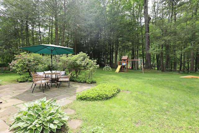 28 Shields Ln, Ridgefield, CT 06877 - view of grassy yard featuring a patio area and a playground