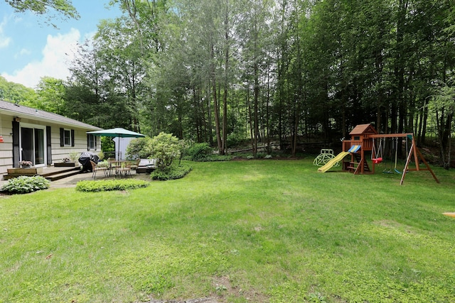 28 Shields Ln, Ridgefield, CT 06877 - view of green lawn featuring a playground and a patio