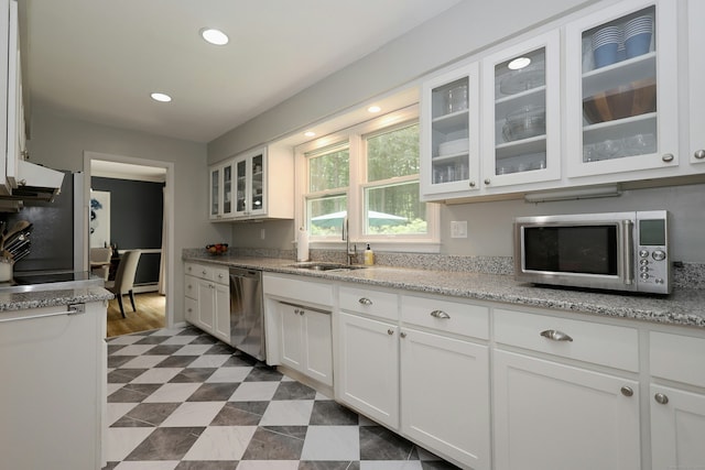 28 Shields Ln, Ridgefield, CT 06877 - kitchen with stainless steel appliances, a sink, white cabinets, glass insert cabinets, and recessed lighting