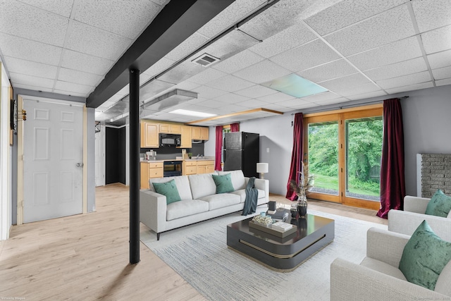 290 Amity Rd, Bethany, CT 06524 - living room featuring light wood-style flooring and a drop ceiling