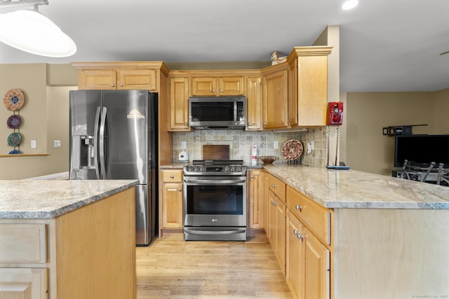 290 Amity Rd, Bethany, CT 06524 - kitchen featuring appliances with stainless steel finishes, light wood-type flooring, a peninsula, decorative backsplash, and recessed lighting