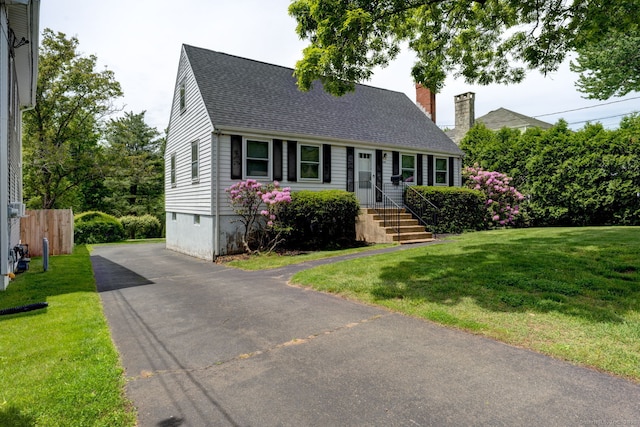 394 Mcclintock St, New Britain, CT 06053 - cape cod-style house with driveway, roof with shingles, and a chimney