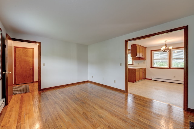 394 Mcclintock St, New Britain, CT 06053 - unfurnished living room with baseboard heating, a chandelier, light wood-type flooring, and baseboards