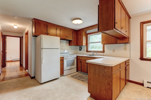 394 Mcclintock St, New Britain, CT 06053 - kitchen featuring white appliances, a peninsula, a sink, brown cabinetry, and light countertops