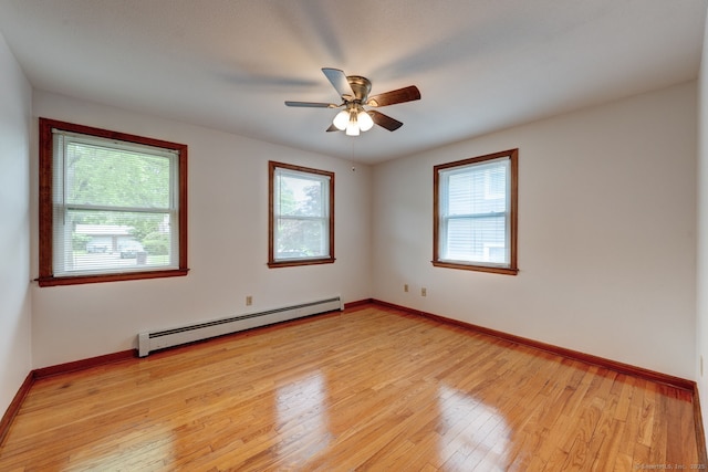 394 Mcclintock St, New Britain, CT 06053 - unfurnished room featuring baseboard heating, plenty of natural light, light wood-style flooring, and baseboards