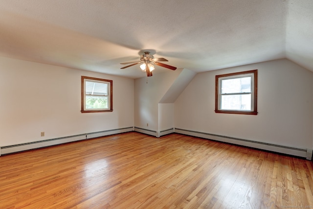 394 Mcclintock St, New Britain, CT 06053 - bonus room featuring healthy amount of natural light, light wood-style floors, a ceiling fan, vaulted ceiling, and baseboard heating