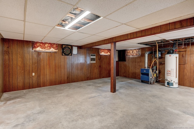 394 Mcclintock St, New Britain, CT 06053 - basement featuring gas water heater, a drop ceiling, wooden walls, and a heating unit