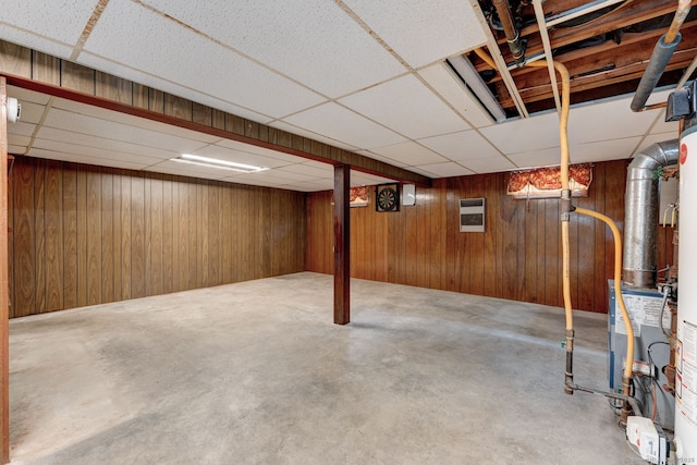 394 Mcclintock St, New Britain, CT 06053 - finished below grade area featuring a drop ceiling, wooden walls, and heating unit